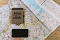 Lay flat of map, notebook and phone Royalty Free Stock Photo