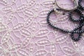 Lay Flat pink background and the gorgeous lace, glittering necklace of black pearls, and stylish bracelet. Beauty and fashion Royalty Free Stock Photo