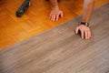 Lay vinyl flooring on old parquet Royalty Free Stock Photo