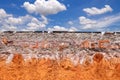 Layer of soil beneath the asphalt road with blue sky