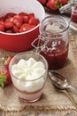 Layer strawberry dessert with whipped cream topping Royalty Free Stock Photo