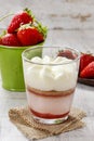 Layer strawberry dessert with whipped cream topping Royalty Free Stock Photo