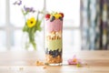 layered berry smoothie in a tall glass