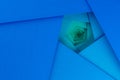 Layered blue cardboard sheets forming a pentagonal spiral pattern.