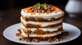 A layered carrot cake with cream cheese frosting and chopped nuts on top Royalty Free Stock Photo