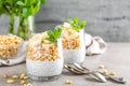 Layered chia pudding parfait with banana, sweet wheat with honey and yogurt