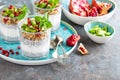 Layered chia pudding parfait with kiwi fruit, pomegranate, granola and yogurt Royalty Free Stock Photo