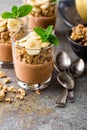 Layered chocolate chia pudding parfait with banana, granola and yogurt, dessert Royalty Free Stock Photo