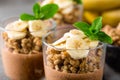 Layered chocolate chia pudding parfait with banana, granola and yogurt, dessert Royalty Free Stock Photo