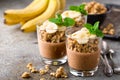 Layered chocolate chia pudding parfait with banana, granola and yogurt, dessert Royalty Free Stock Photo