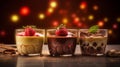 Layered chocolate, coffee and caramel mousses with strawberries and a cozy blur background Royalty Free Stock Photo