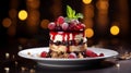 a layered dessert with berries and cream on a white plate with a blurred background. It is a decadent and indulgent