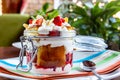 Layered Dessert of chocolate sponge cake, whipped cream or ricotta and fresh strawberries in a glass bowl. Trifle Royalty Free Stock Photo