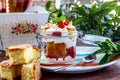 Layered Dessert of chocolate sponge cake, whipped cream or ricotta and fresh strawberries in a glass bowl. Trifle Royalty Free Stock Photo