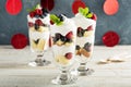 Layered dessert parfait with sweet bread and berries
