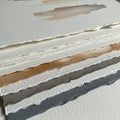 Layered Handmade Paper Stack with Deckled Edges Royalty Free Stock Photo