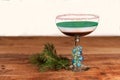 Layered holiday drink with candy cane rim - ready for christmas happy hour