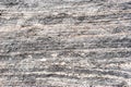 Layered metamorphic rock background texture. Royalty Free Stock Photo