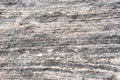 Layered metamorphic rock background texture. Royalty Free Stock Photo