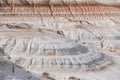 Layered multi-colored hills and slopes with relief from water and wind Royalty Free Stock Photo