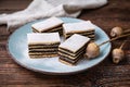 Layered poppy seed cake dusted with powdered sugar Royalty Free Stock Photo