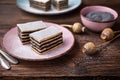 Layered poppy seed cake dusted with powdered sugar Royalty Free Stock Photo