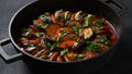 Layered ratatouille in a baking dish, slices of zucchini, red bell pepper, chili, yellow squash, eggplant, olive oil, parsley and