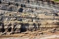 layered rock patterns in a sedimentary cliff