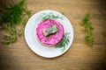 Layered salad of boiled vegetables with beets and herring Royalty Free Stock Photo