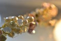 Layered triangular macro diamond shapes with a small diamond over them with bokeh background Description92/200 Backgrounds/