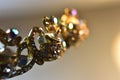 Layered triangular macro diamond shapes with a small diamond over them with bokeh background Description92/200 Backgrounds/