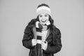 Layered up for wintry weather. Happy child with winter look. Little girl smile in casual winter style. Fashion winter Royalty Free Stock Photo