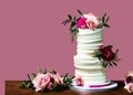 layered wedding cake with roses and cream on neutral background AI, minimalist style, tone on tone colors Royalty Free Stock Photo