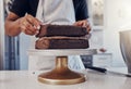 Layering, preparation and hands of a man with a cake for a birthday, dessert and sweet treat. Kitchen, working and chef Royalty Free Stock Photo