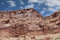 Layers of Entrada Sandstone behind the road leading into Arches National Park