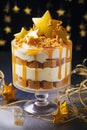 Layers of gingerbread cake, vanilla custard, and caramel sauce topped with whipped cream and a gingerbread cookie Royalty Free Stock Photo