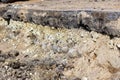 layers in the ground, telling the story of the construction the road in Gatchina. Visible layer stone rubble age 250 years - the