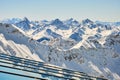 Layers of mountain peaks reflected on glass - view from Parpaner Rothorn upper cable station in Arosa Lenzerheide resort