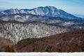 Layers of mountain ridges in the Carpathian mountains, Romania, during a Winter hike Royalty Free Stock Photo