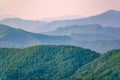 Layers of mountains in the haze during sunset. Beautiful sunset in the hills and mountains. Beautiful sunset in a hilly valley Royalty Free Stock Photo