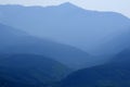 Layers of Mountains and Pine Tree Forest Wilderness in Haze Royalty Free Stock Photo