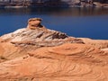 Layers of rock form a weathered spire at Lake Powell in Arizona Royalty Free Stock Photo