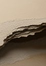 Layers of rough, beige-colored paper sheets with frayed edges, creating a textured appearance. The Royalty Free Stock Photo