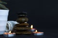 the Layers of stones in the dark with burning candles light used in massage therapy, relaxing time ellement, wallper, pattern,