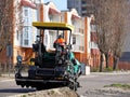 Laying asphalt with the help of heavy special equipment. The construction of the road. Modern technologies laying highway with a