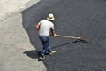 Laying asphalt. Road repairs. Hot asphalt on the road.