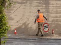 Laying asphalt by workers. Road construction. Modern technology of laying a highway with a solid surface. People work at a