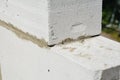 Laying autoclaved aerated concrete blocks for house wall. Close up on laying blocks Royalty Free Stock Photo