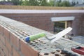 Laying bricks. Construction of a new house.Construction of a brick house Royalty Free Stock Photo