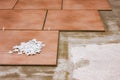 Laying ceramic tiles and tile spacers